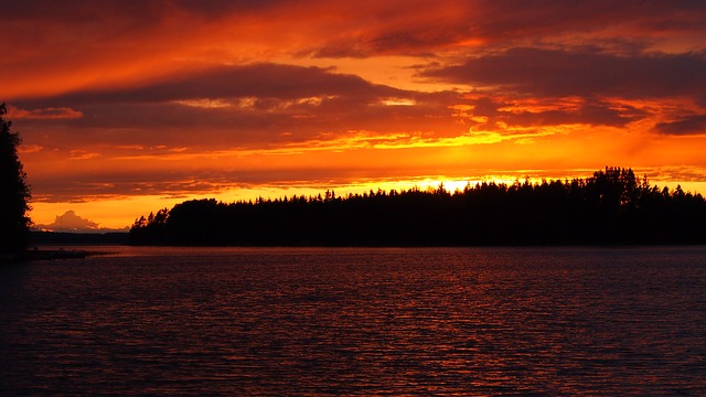 Photo of orange sunset over lake