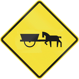 A gag road hazard sign showing a horse pushing a cart.